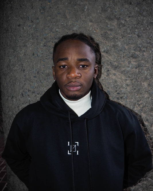 ØbscureVerse high-neck black hoodie styled as a dark streetwear outfit